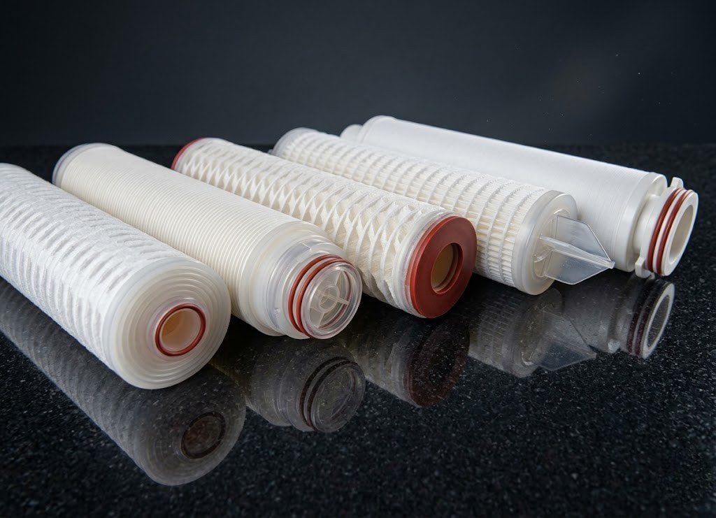 High-resolution catalog shot of a 6-inch high flow PP pleated filter cartridge, heavy-duty outer PP cage